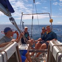 Yacht Crew- A sunny day on the Indian Ocean and a crew of Offshore Sailing Academy students are Smiling at the Camera