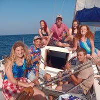 Yacht Crew- A sunny day on the Indian Ocean and a crew of Offshore Sailing Academy students are Smiling at the Camera
