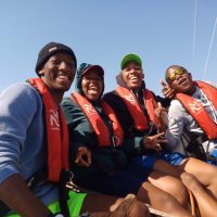 Coastal Skipper Course -A sunny day on the Indian Ocean and a crew of Offshore Sailing Academy students are Smiling at the Camera